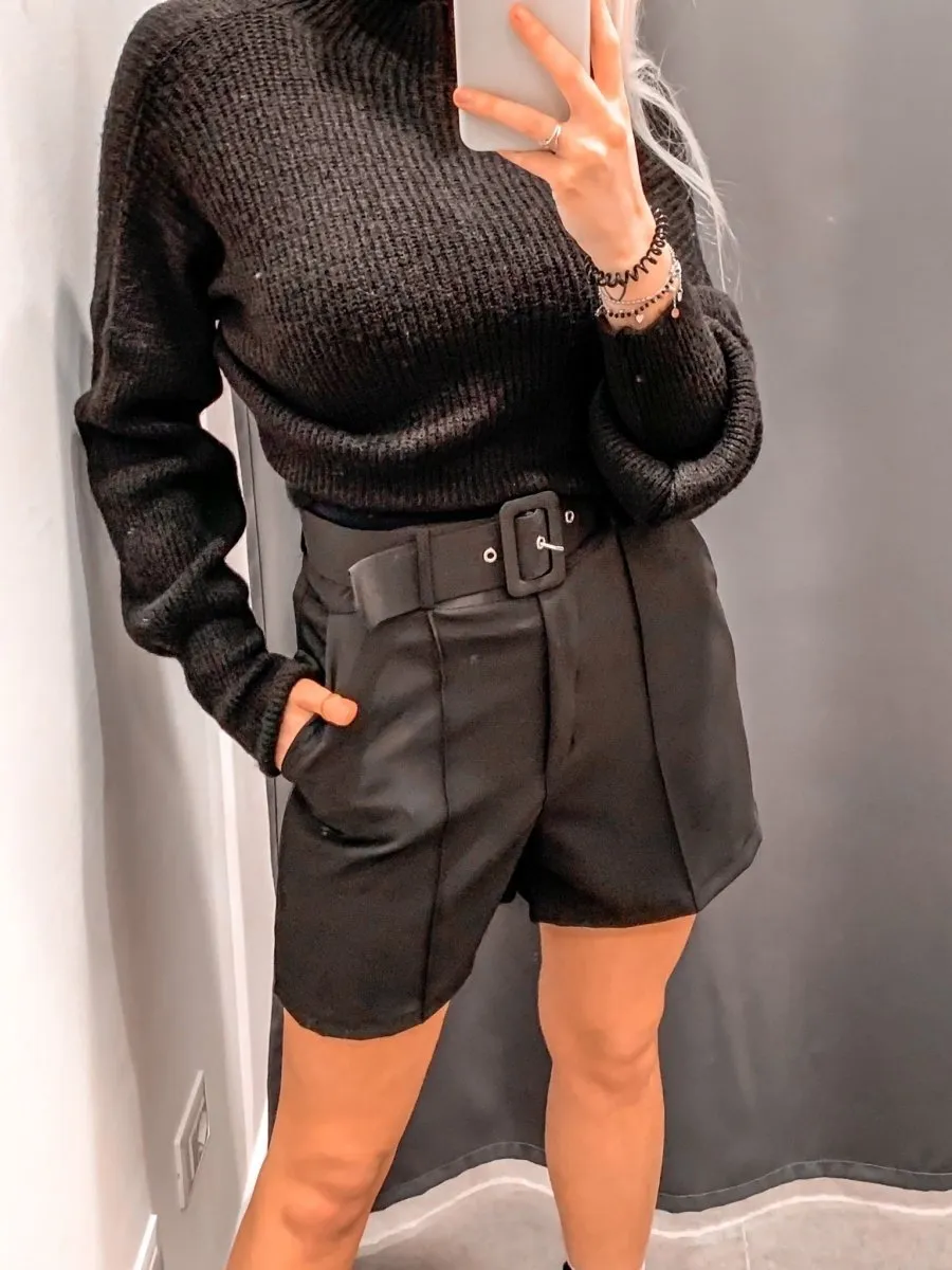 Black stretch shorts with belt.