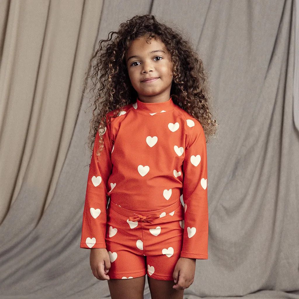 Red Child Hearts Swim Shorts by Mini Rodini